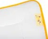 A close-up view of a white baby pillow with a yellow trim and a small yellow tag. Produktbild-Vorschau