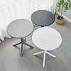 Three round tables of different colors (gray, white, and dark gray) are arranged on a tiled floor, with sheer curtains in the background. Náhľad obrázku produktu