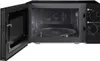 An open black microwave oven with a glass turntable inside. Anteprima dell’immagine prodotto