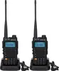 Two black Retevis RA685 amateur radio transceivers are shown in their charging docks, against a white background. Voir les images du produit