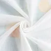 A close-up shot of white fabric with a subtle floral pattern, folded and swirled. Produktbild-Vorschau