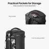 A split image showing different pockets of a black backpack. The top part shows a close-up of the top pocket with a passport and card. The bottom part shows the front and side pockets with a water bottle and other items. Produktbild-Vorschau