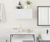 A clean, minimalist bathroom scene featuring a white wall-mounted cabinet, a sink, and various bathroom accessories. Náhled obrázku produktu