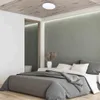 A bedroom with a bed, a dresser, and a toilet visible through a doorway. Podgląd zdjęcia produktu