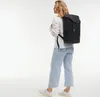 A person wearing a backpack. Produktbild-Vorschau