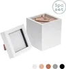 A stack of white boxes and one box standing in front of them, on a white background. Produktbild-Vorschau