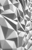 A close-up, angled view of a white, geometric, textured wall panel. Produktbild-Vorschau