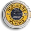 A top-down view of a round metal tin of L'Occitane Shea Butter. Voir les images du produit