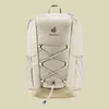 A front view of a beige Deuter backpack against a light beige background. Voir les images du produit