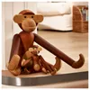 Two wooden monkey figures, one large and one small, sitting on a shelf. Náhled obrázku produktu