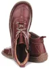 A pair of red leather ankle boots. Anteprima dell’immagine prodotto