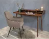 A chair and desk set in a room setting. Voir les images du produit