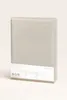 A folded jersey fitted sheet is presented upright against a light gray background. Produktbild-Vorschau