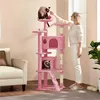 A woman is interacting with a cat on a pink cat tree in a living room. Produktbild-Vorschau
