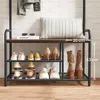 A shoe rack and coat rack in a hallway with shoes and a pillow on it. Náhled obrázku produktu