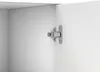A close-up view of a cabinet hinge on a white surface. Produktbild-Vorschau