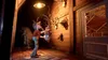 A cartoon character is holding a deer head mount in a rustic, wood-paneled hallway with other mounted animal heads on the wall. Náhľad obrázku produktu