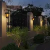 Outdoor fence with solar-powered wall lights at dusk. Produktbild-Vorschau
