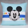 A close-up of a pillow with Mickey Mouse printed on it. Produktbild-Vorschau