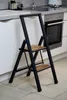 A step stool is placed in a kitchen setting. Podgląd zdjęcia produktu