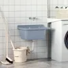 A utility sink and washing machine in a laundry room. Produktbild-Vorschau