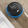 A black robot vacuum cleaner with a blue mop pad is cleaning a wooden floor. Podgląd zdjęcia produktu