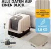A beige and dark gray cat litter box with a lid and a scoop, placed on a tiled floor next to a mat. Dimensions and material information are displayed with text overlays. Produktbild-Vorschau