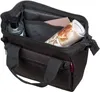 An open black bag with items inside. Produktbild-Vorschau