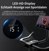 A close-up of a smart indoor speedbike's display and handlebars, with a person visible on the screen. Produktbild-Vorschau