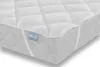 A close-up view of a white quilted mattress topper placed on a mattress. Anteprima dell’immagine prodotto