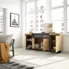 A modern living room with a sideboard featuring an electric fireplace, large windows, and a framed picture on the wall. Produktbild-Vorschau