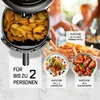 A collage showing an air fryer filled with fries, and plates of salmon and chicken wings, with text overlays describing capacity and serving sizes. Produktbild-Vorschau