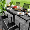 An outdoor dining set with a table and chairs on a deck, set for a meal. Náhled obrázku produktu