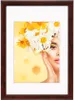 A framed portrait of a woman with flowers in her hair. Produktbild-Vorschau