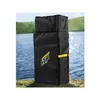 A black carrying bag for a stand-up paddleboard is shown outdoors by a body of water. Produktbild-Vorschau