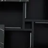 A close-up abstract view of a modern black furniture piece with marble-like accents and metallic drawer slides. Produktbild-Vorschau