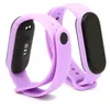 Two purple fitness trackers are shown against a white background. Voir les images du produit