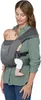 A woman is holding a baby in a baby carrier. Produktbild-Vorschau