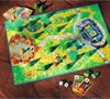 A board game set on a wooden surface, with cards and dice scattered around. Podgląd zdjęcia produktu