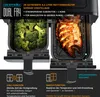 A dual-chamber air fryer with broccoli in one chamber and a cooked fish in the other, showcasing its dual cooking capabilities and features. Produktbild-Vorschau
