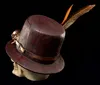A steampunk-themed skull wearing a top hat with feathers and goggles, set against a black background. Produktbild-Vorschau