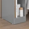 Close-up of a gray nightstand with books and a decorative bottle on a shelf. Produktbild-Vorschau
