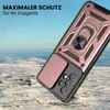A rose gold phone case with a camera cover and ring stand is shown in a rugged, snowy landscape. Produktbild-Vorschau