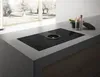 A modern kitchen island with a built-in induction cooktop and downdraft ventilation system. Náhled obrázku produktu