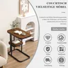 A small side table with a book and coffee cup on it, placed next to a sofa and a decorative shelving unit. Produktbild-Vorschau