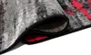A close-up view of a rolled-up rug, showing the texture and pattern. Anteprima dell’immagine prodotto