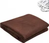 A folded brown mesh safety net with white ties in the upper right corner, set against a white background. Náhľad obrázku produktu