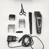 A collection of hair clipper accessories and a charger laid out on a white background. Produktbild-Vorschau