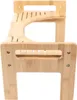 A close-up, side view of a wooden toilettenhocker (toilet stool). Náhled obrázku produktu