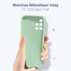 A hand holding a light green phone case with a microfiber inlay. Produktbild-Vorschau
